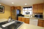 Fully Equipped Kitchen and Dining Area in Vacation Condo